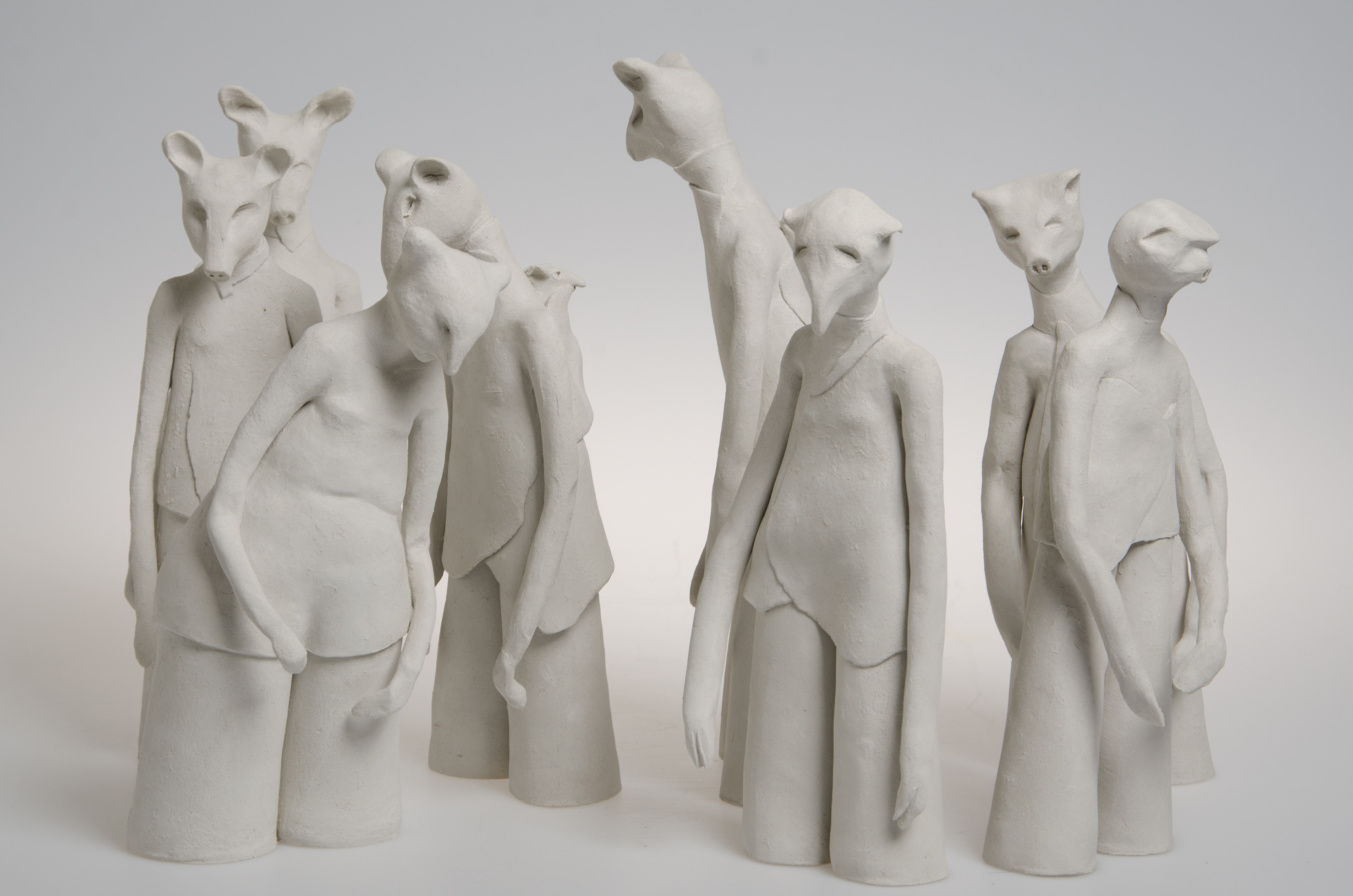multiple ceramic sculptures representing people