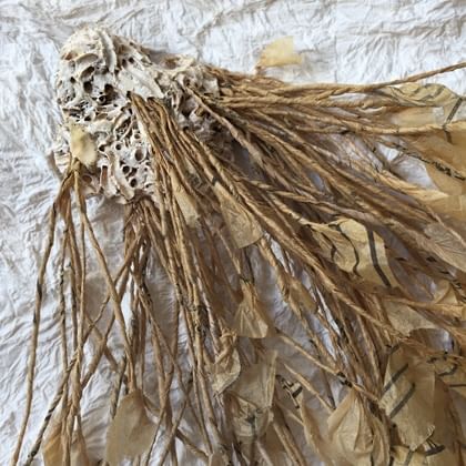 sculpture of plant branches made from pattern paper