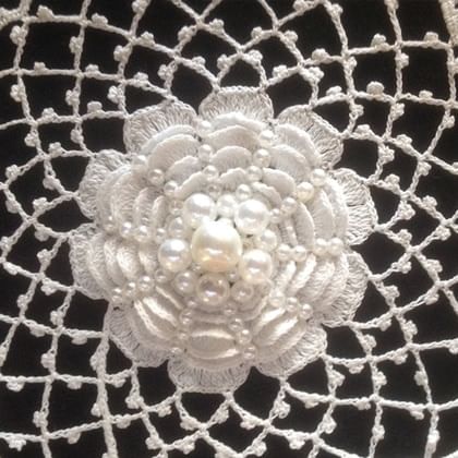 detail of crocheted flower