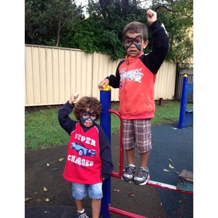 two children on playground equipment