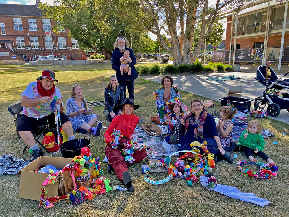 people with artwork they have made in Lismore Quad