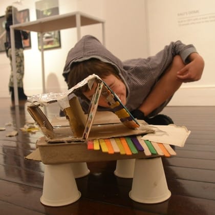 child with craft creation