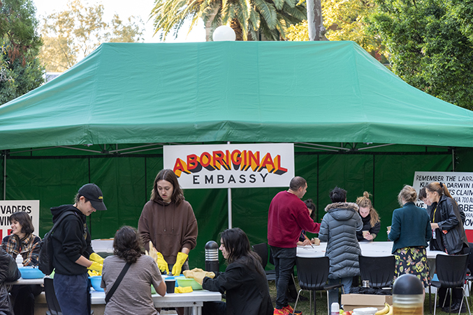 A photo of the 'Aboriginal Embassy' artwork with people during an event