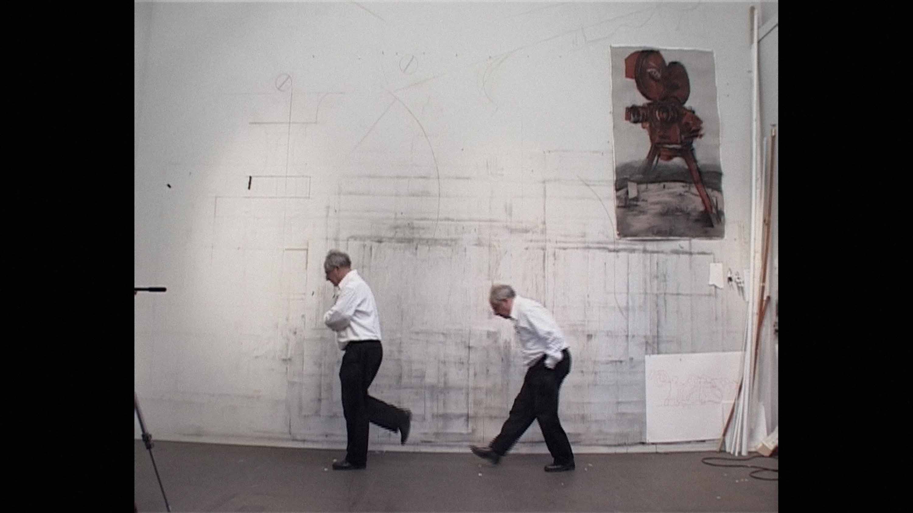 two men walking in front of a wall - image is of the same man in different walking positions.