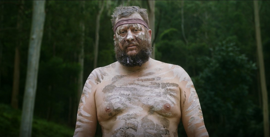 Aboriginal man from Wonnarua nation  with forest in the background