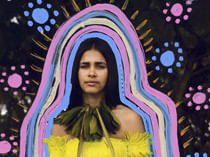 young woman surrounded by bright coloured lines and painted patterns