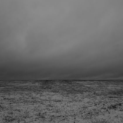image of storm clouds above treeless landscape
