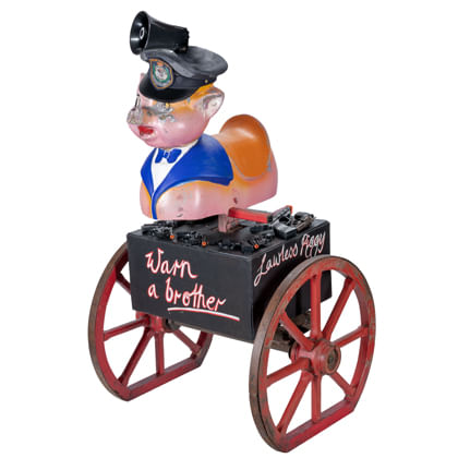 sculpture of found objects with a to pig on a cart