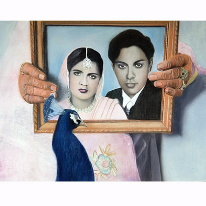 framed image of man and woman with a peacock in front