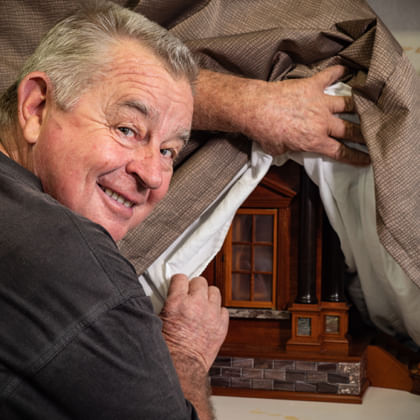 geoff hannah pulls back the covers to show a sneak preview of his latest piece of woodwork