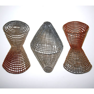 Three ceramic pieces with different cut out patterns