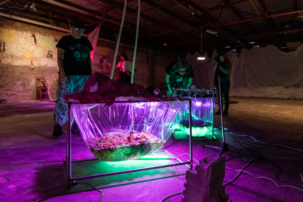 people looking at sculptures 