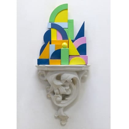 decorative plaster shelf with sculpture constructed of wooden blocks