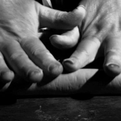 four hands on top of each other 