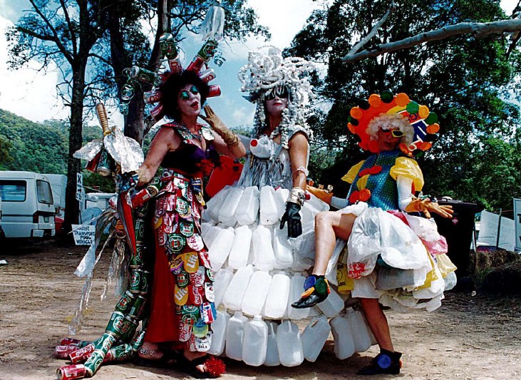 Three people wearing fabulous costumes of recycled materials 
