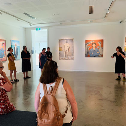 group of people viewing art the  in gallery with Auslan interpreterr 