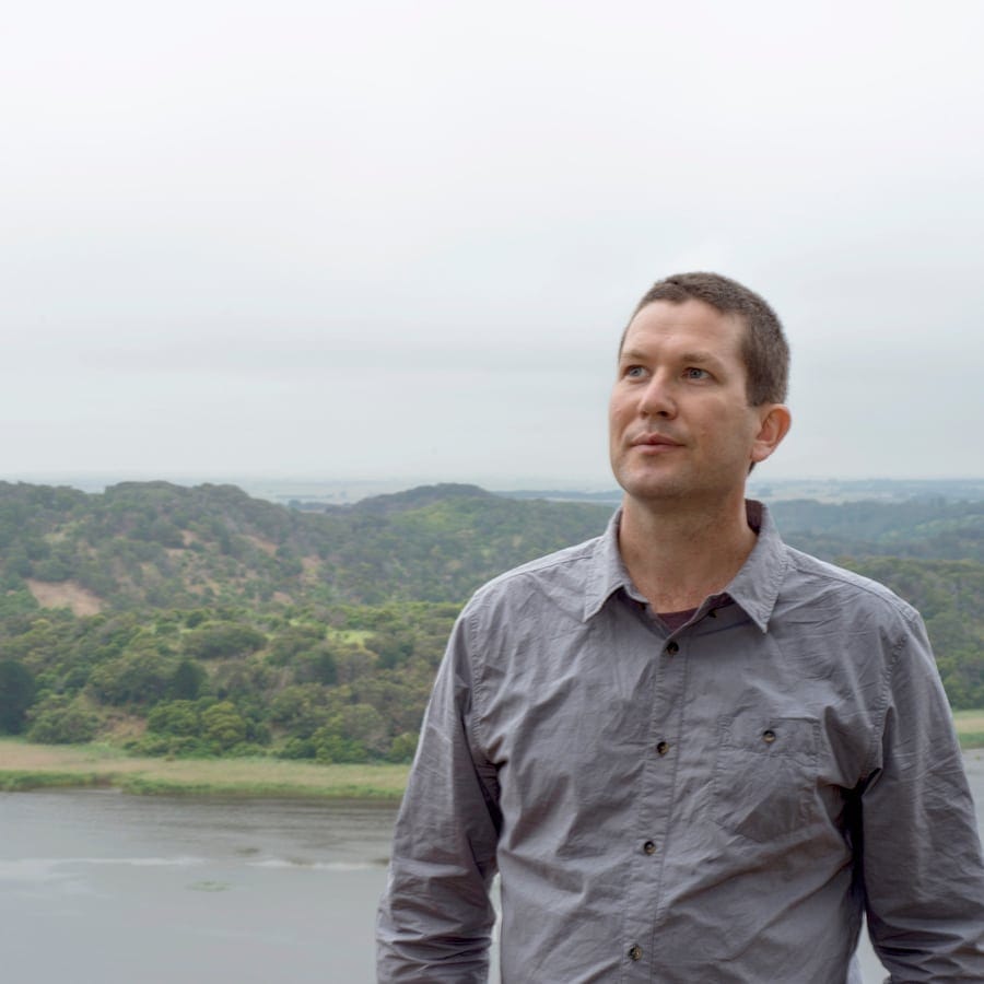 photo of Hobie Porter in front of river and hills
