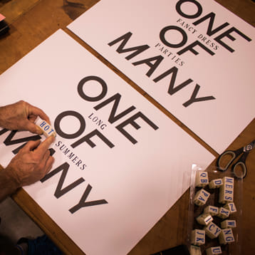 person creating artwork with stamps 
