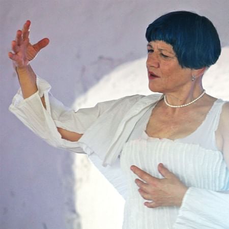 image of artist with one arm raised 