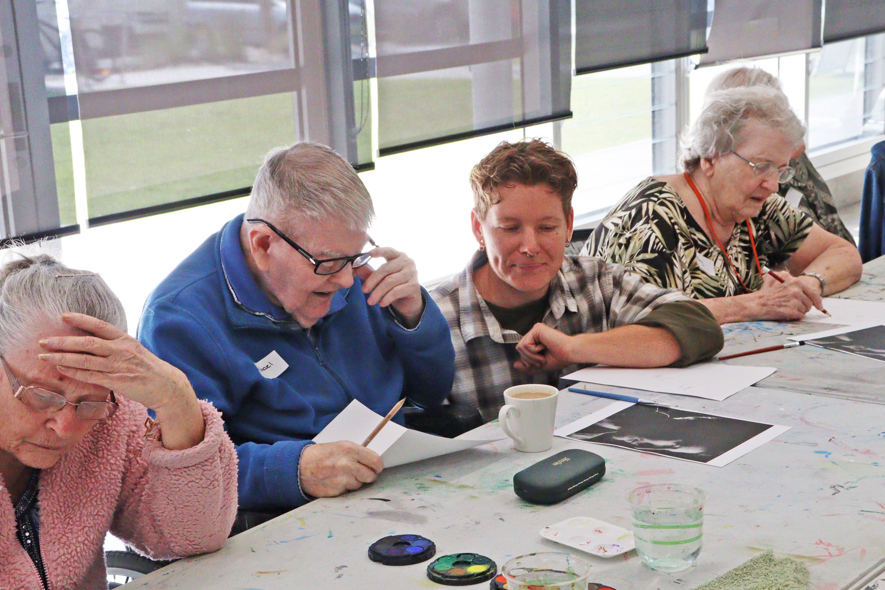 A group of seniors enjoying an art activity