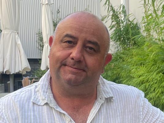 A portrait of Greg Peters