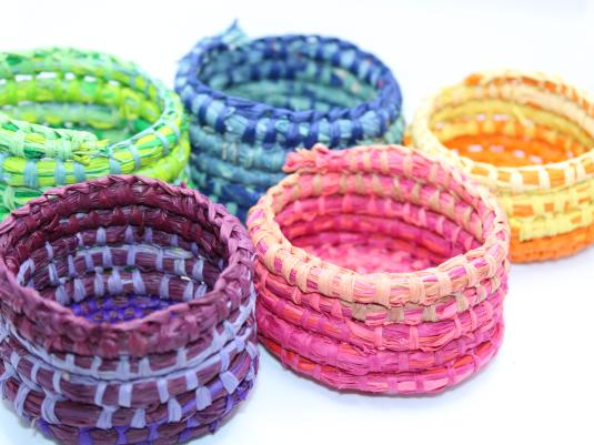 5 small colourful woven baskets
