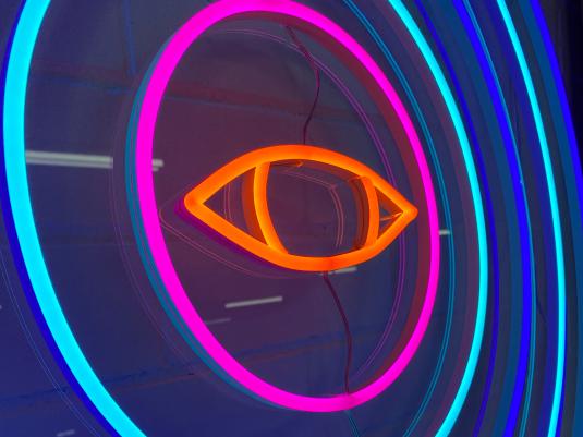 Neon light rings around a neon light eye
