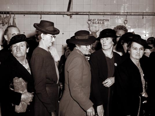 women in queue in butcher shop
