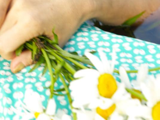 a hand with bunch of flowers