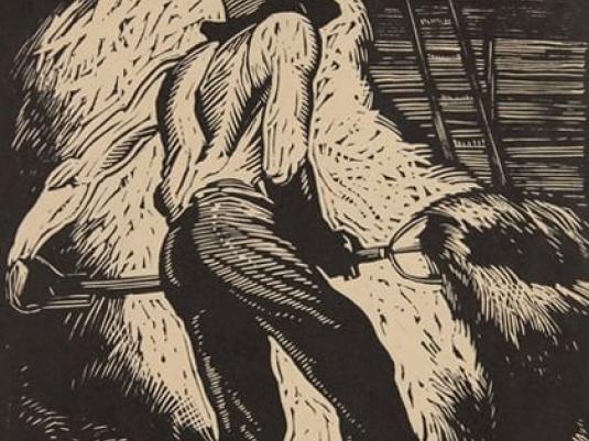 man moving hay with a fork