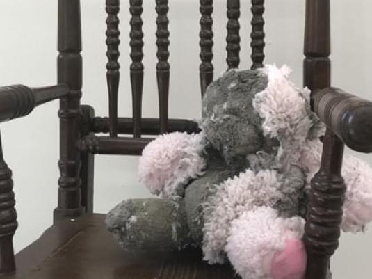 teddy bear in chair