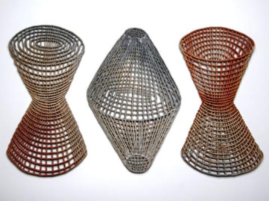 Three ceramic pieces with different cut out patterns