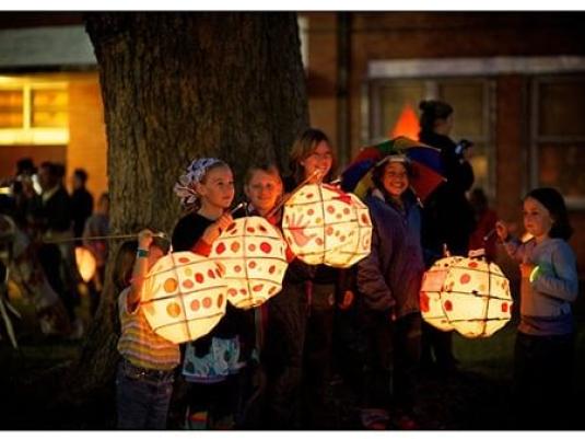 group of children holding paper lanterns