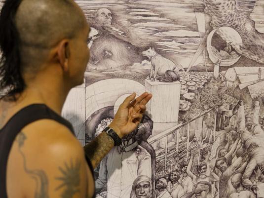 person looking at artwork