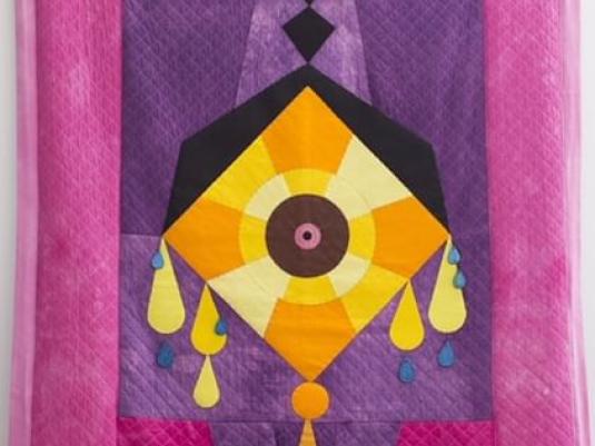 patchwork panel with purple and pink background and orange and yellow diamond