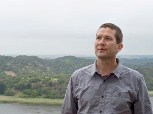 photo of Hobie Porter in front of river and hills