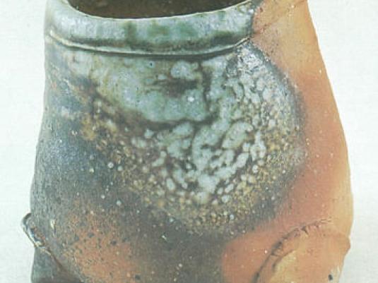 woodfired pot with green mottled glaze on part of it