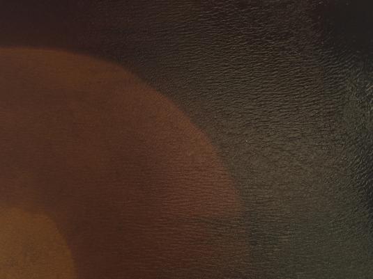 A brown and oche abstract image